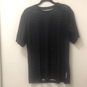 Men’s Medium Reebok black Tshirt with design. Fine mesh under arms.